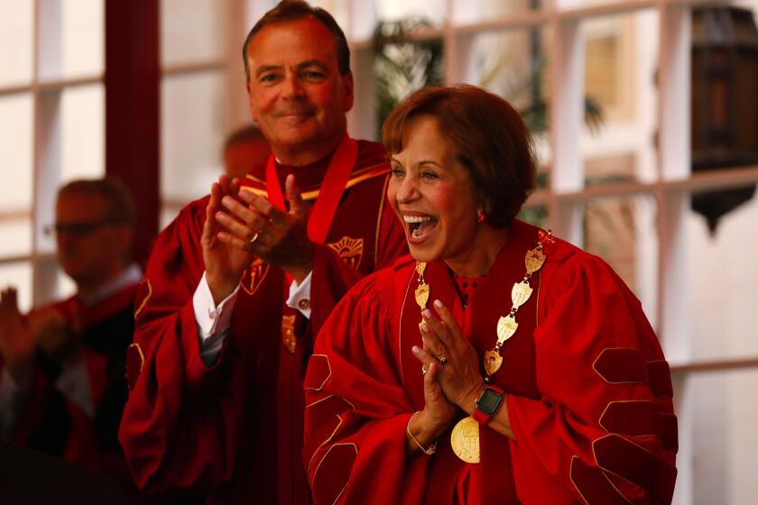 Al SeibLos Angeles Times CAROL FOLT, who was inaugurated Friday as USC’s 12th president, celebrates with Rick Caruso, chairman of the board of trustees.