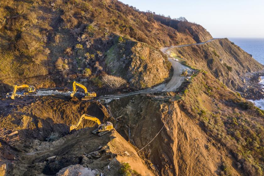 Big Sur, CA, Wednesday, February 10, 2021 -Crews continue to dig out debris from a washed out section of Highway 1 at Rat Creek. (Robert Gauthier/Los Angeles Times)