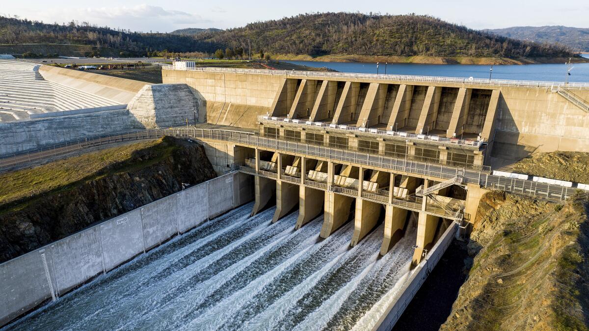 Water flows through the Oroville Dam spillway at Lake Oroville.