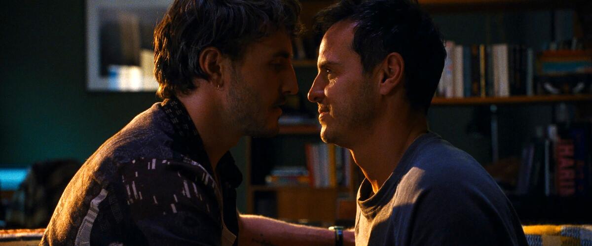 Paul Mescal and Andrew Scott sit very close together looking into each others' eyes in "All of Us Strangers."