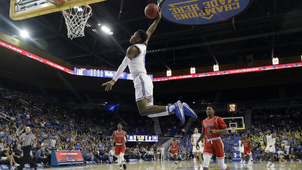 UCLA guard Jaylen Hands goes up for a dunk against Saint Francis during the second half on Friday.
