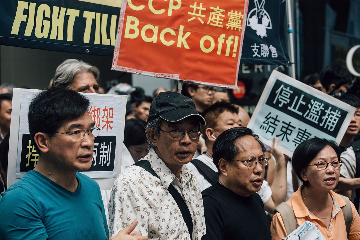 Hong Kong bookseller Lam Wing-kee, center, takes part in a protest on June 18, 2016, in Hong Kong.