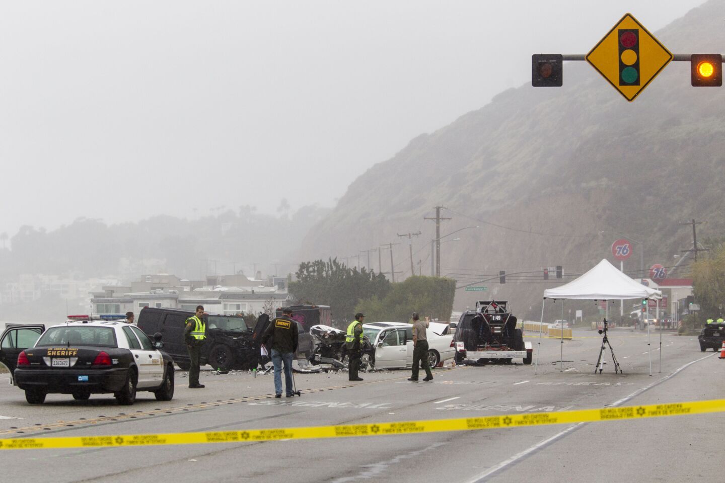 Los Angeles County Sheriff's deputies at the scene. There have been reports that paparazzi photographers also were at the scene of the collision.