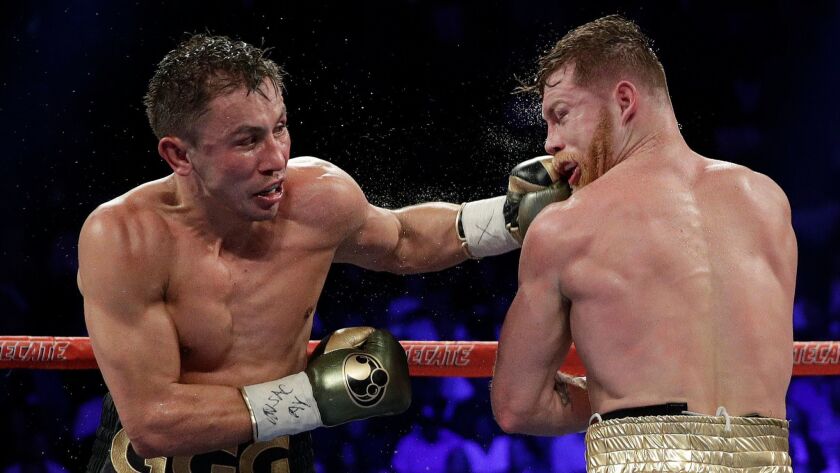Gennady Golovkin connects with a punch to the face of Canelo Alvarez during their middleweight title fight in Las Vegas in September 2017.