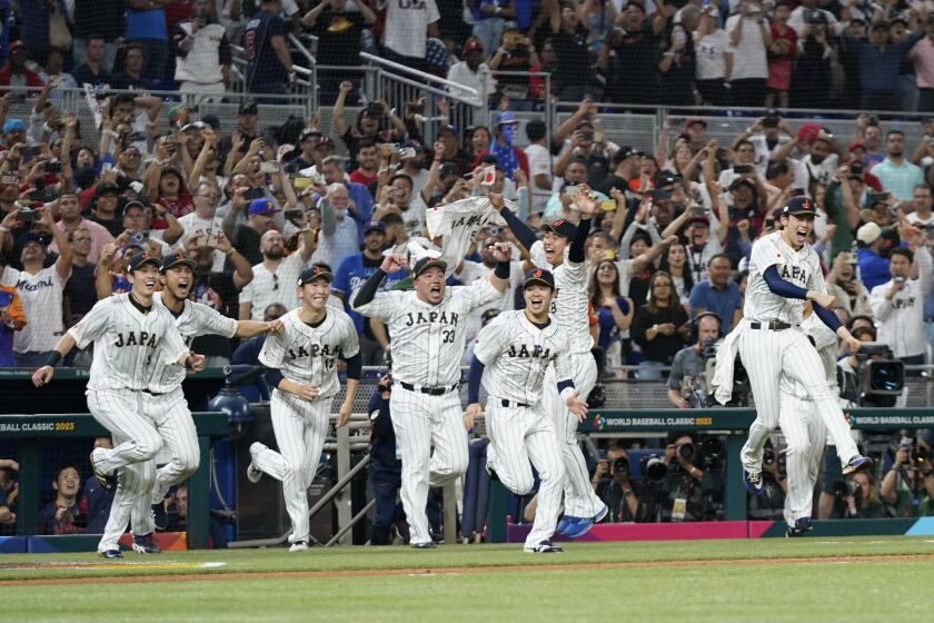 Japan players celebrate after defeating the United States in the World Baseball Classic championship game, Tuesday, March 21, 2023, in Miami. (AP Photo/Wilfredo Lee)