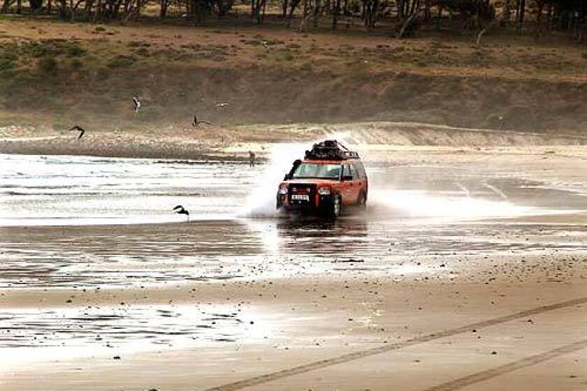 The Land Rover LR3 pushes on through the slack tide on a Chilean beach near Pichidangui, just north of Valparaiso.