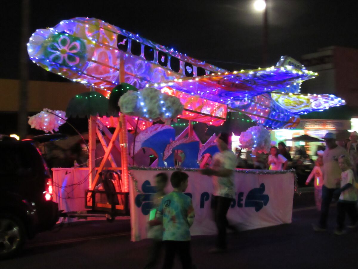 An illuminated float at the OB Holiday Parade in 2019.