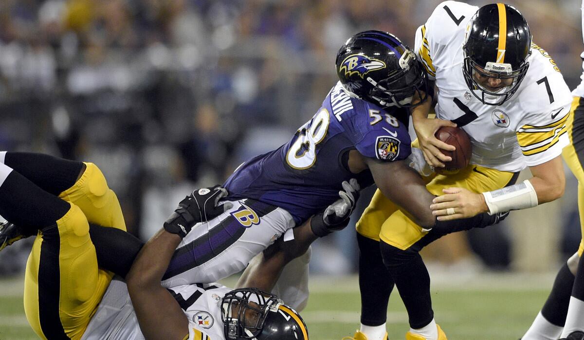 Ravens outside linebacker Elvis Dumervil (58) sacks Steelers quarterback Ben Roethlisberger (7) after running over tackle Marcus Gilbert in the second half Thursday night in Baltimore.