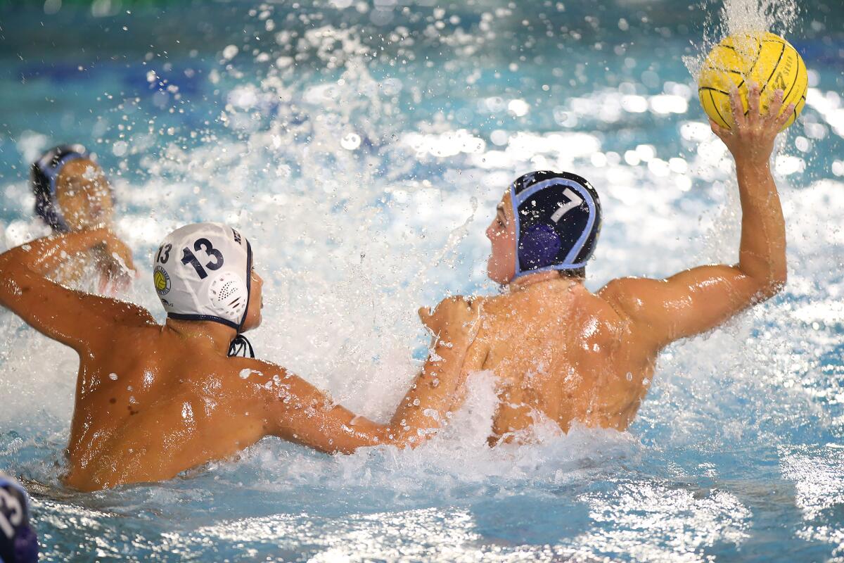 Corona del Mar's Tanner Pulice (7) shoots and scores past Newport Harbor's Ben Liechty (13) in the Battle of the Bay match on Wednesday.