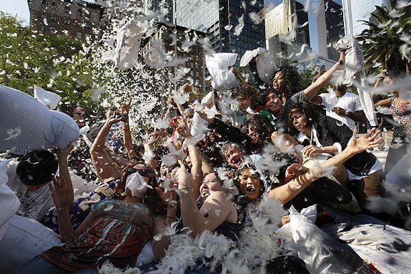 Hundreds of people participate in International Pillow Fight Day in downtown Los Angeles' Pershing Square. See full story