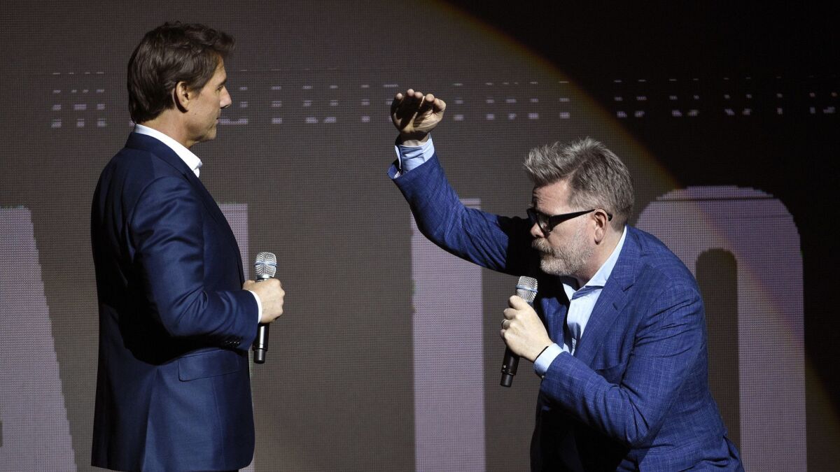 Tom Cruise, left, and writer-director Christopher McQuarrie discuss "Mission: Impossible — Fallout" at CinemaCon 2018.