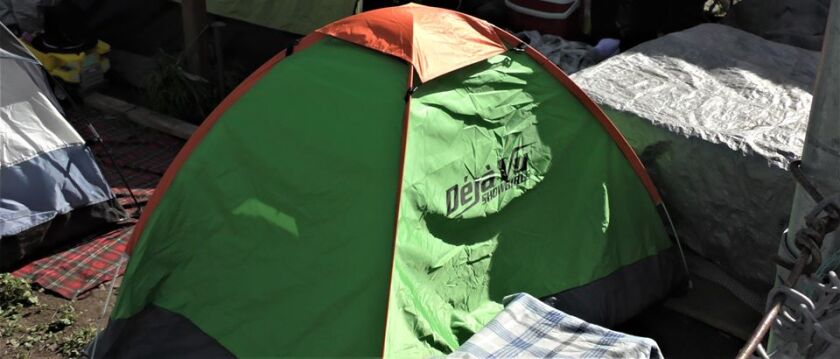The adult entertainment club Deja Vu is providing tents with their logos to homeless people in San Diego and other cities.