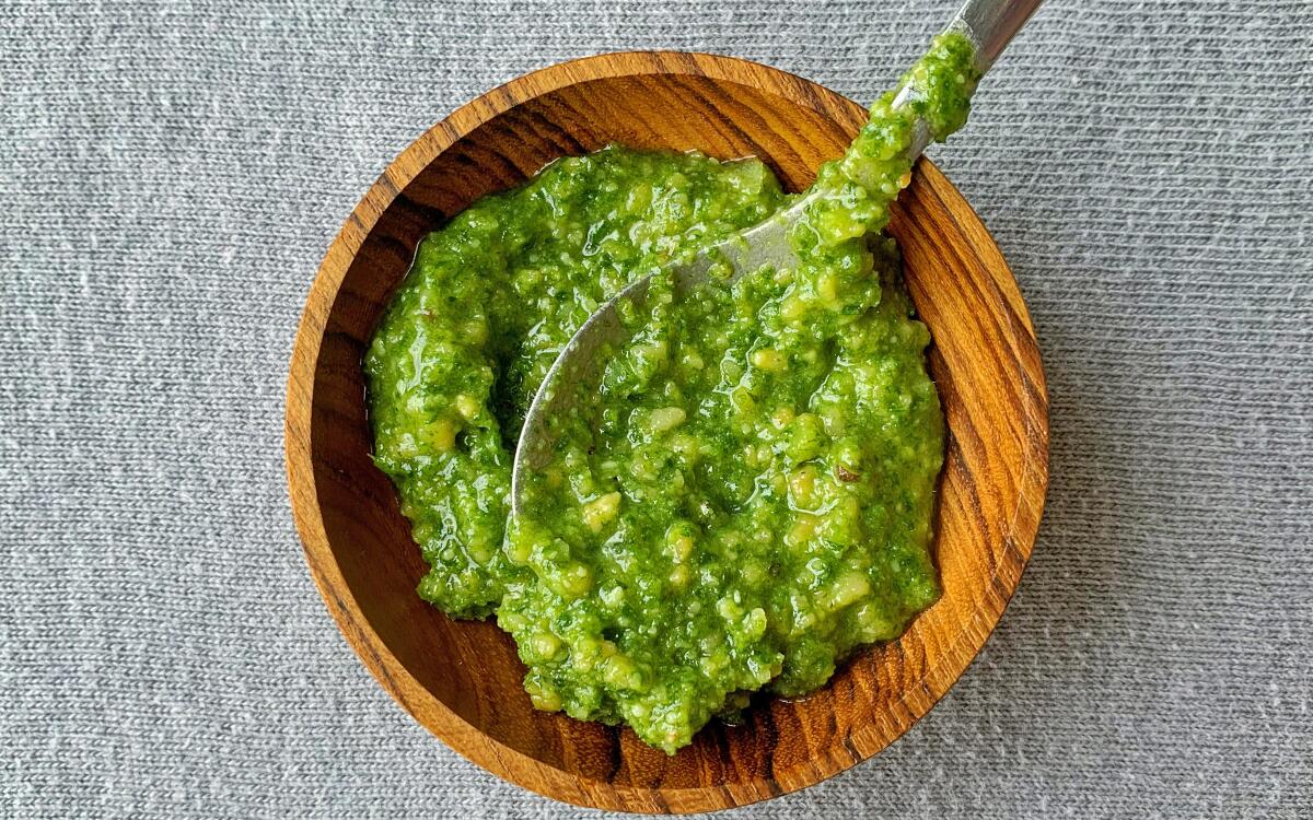 Fragrant carrot tops stand in for parsley in this pesto that comes together easily in a food processor.