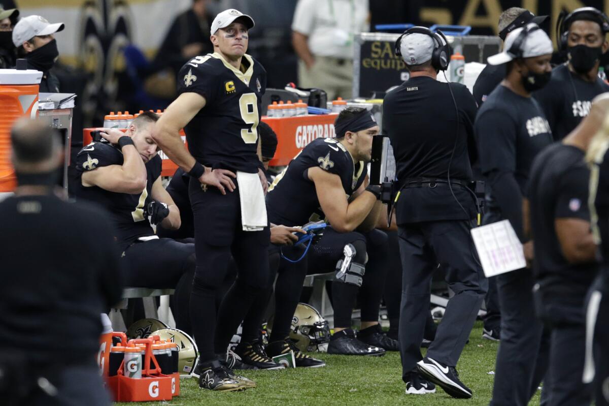 New Orleans Saints quarterback Drew Brees watches from the sideline during the second half against the San Francisco 49ers.