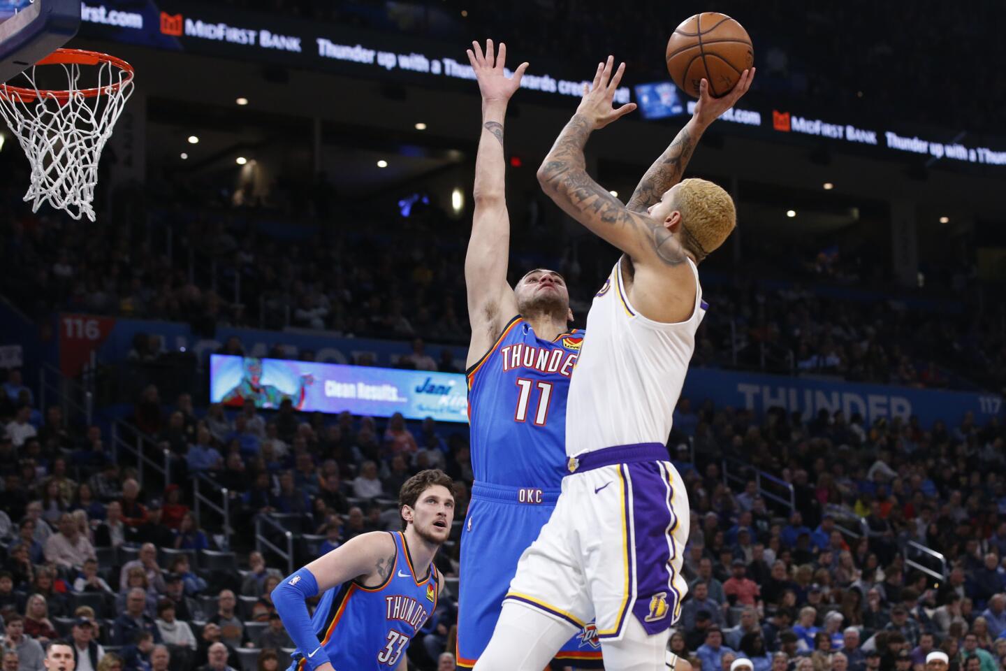 Lakers forward Kyle Kuzma gets up a shot against Thunder forward Abdel Nader (11) during the first half of a game Jan. 11.
