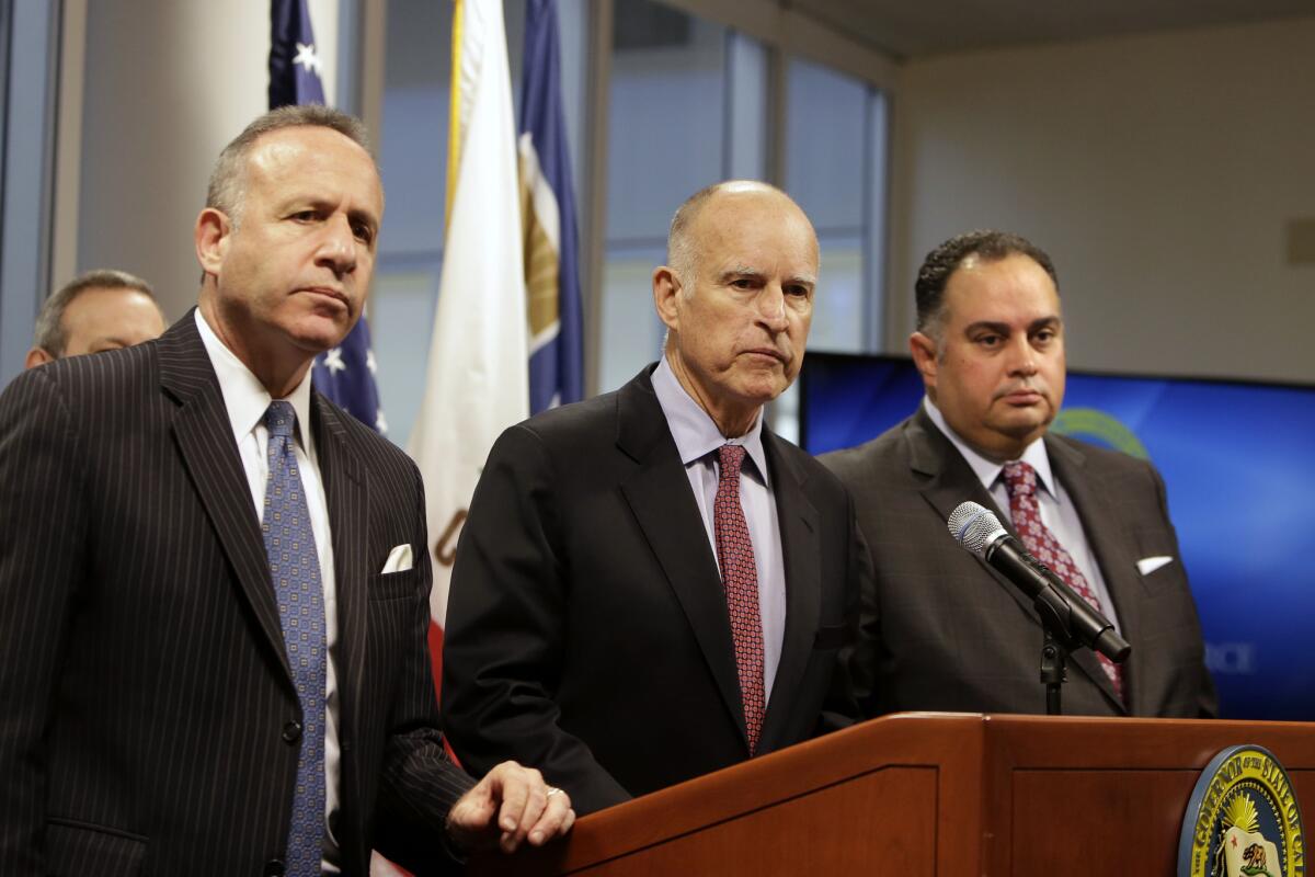 State Senate President Pro Tem Darrell Steinberg (D-Sacramento), left, California Gov. Jerry Brown, center, and Assembly Speaker John Perez (D-Los Angeles) listen to a reporter's question during a press conference on the drought in February.