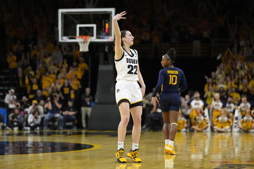 Iowa guard Caitlin Clark (22) celebrates after making a three-point basket in the second half of a second-round college basketball game against West Virginia in the NCAA Tournament, Monday, March 25, 2024, in Iowa City, Iowa. (AP Photo/Charlie Neibergall)