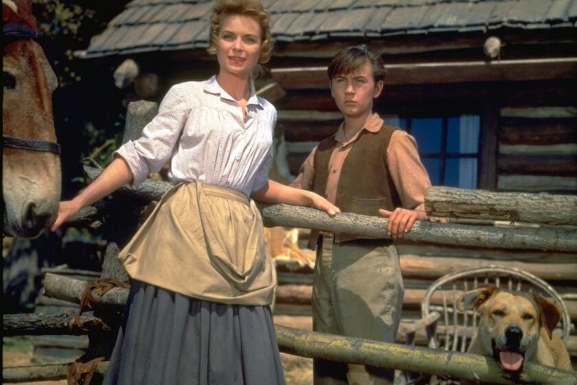 This image released by Disney shows Dorothy McGuire, left, and Tommy Kirk in a scene from the 1957 classic “Old Yeller." The film is among 25 films to be added to the National Film Registry of the Library of Congress. (Disney via AP)
