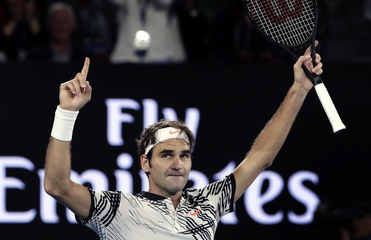 Roger Federer celebrates after winning a semifinal match against Stan Wawrinka at the Australian Open on Jan. 26.