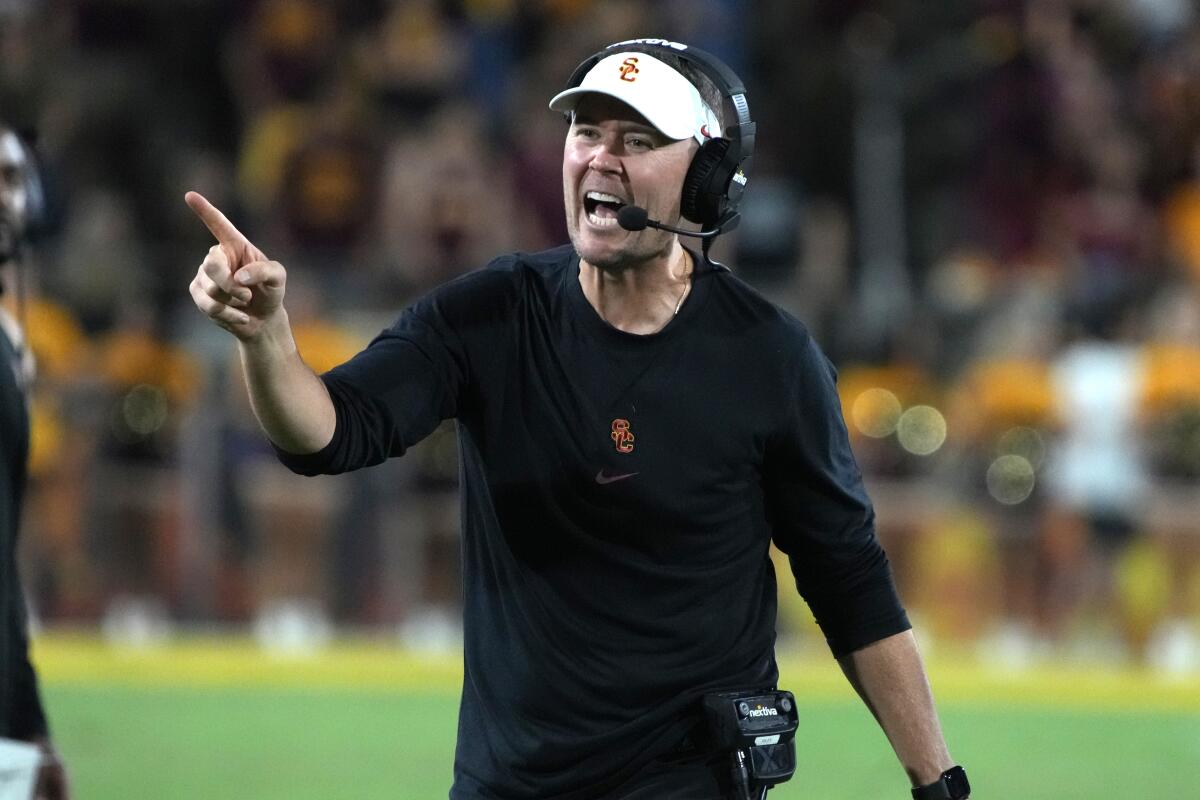 USC coach Lincoln Riley shouts on the sideline while pointing his finger during a game against Arizona State