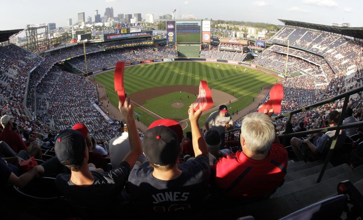 Atlanta Braves fans cheer on their team during Game 2 of the National League division series against the Dodgers on Friday.