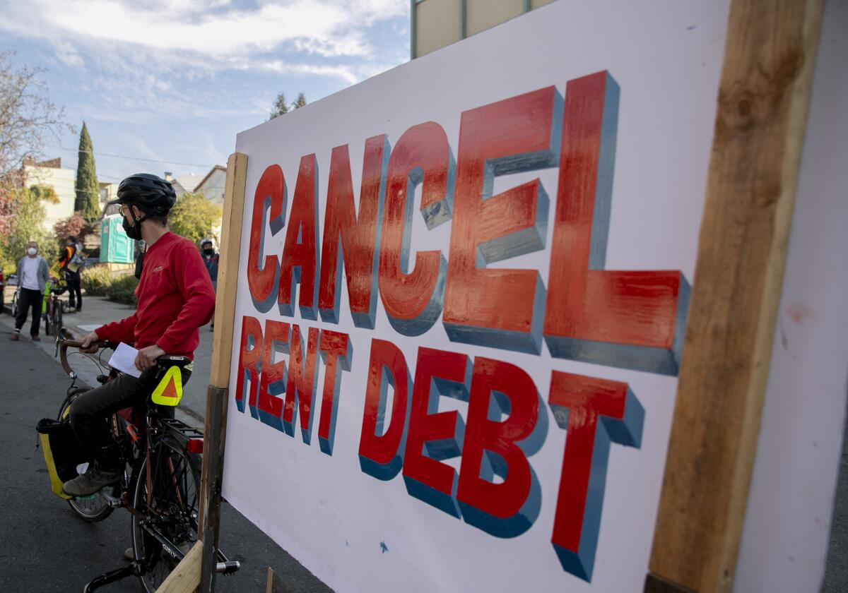 Demonstrators protest against pandemic evictions on Dec. 5, 2020 in the Adams Point neighborhood of Oakland. Photo by Anne Wernikoff, CalMatters