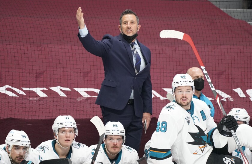 San Jose Sharks head coach Bob Boughner waves goaltender Martin Jones off the ice late in the third period of an NHL hockey game against the Colorado Avalanche, Friday, April 30, 2021, in Denver. (AP Photo/David Zalubowski)