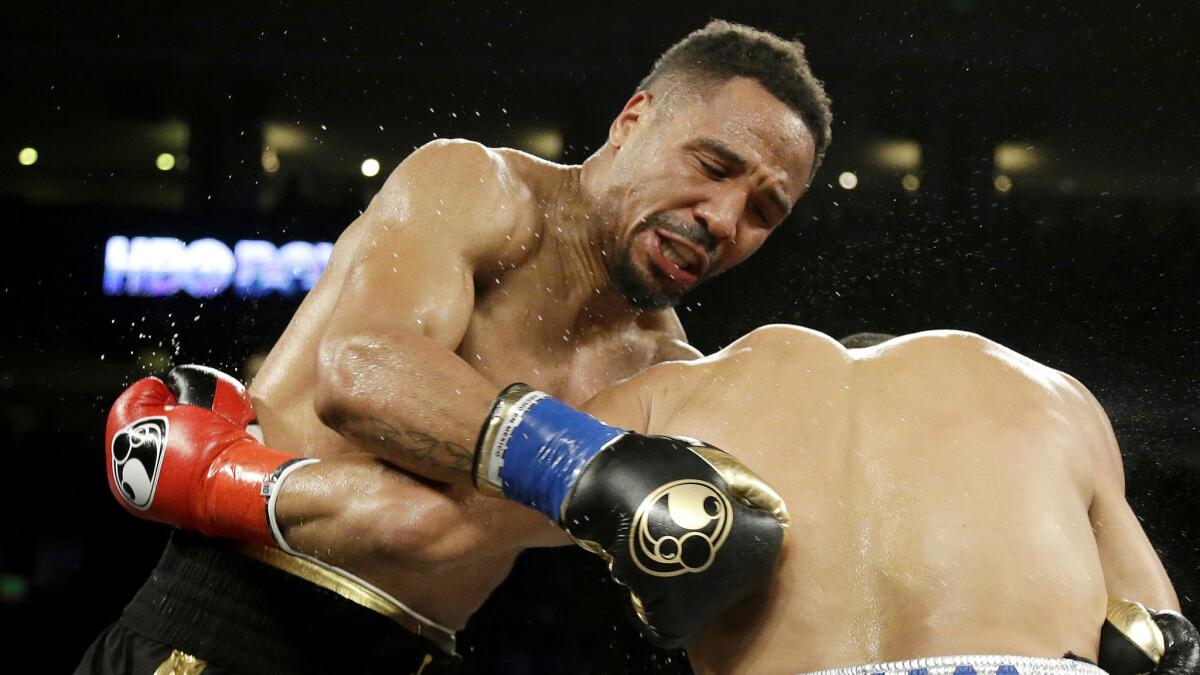 Andre Ward, left, fights Alexander Brand during a light-heavyweight bout on Aug. 6.
