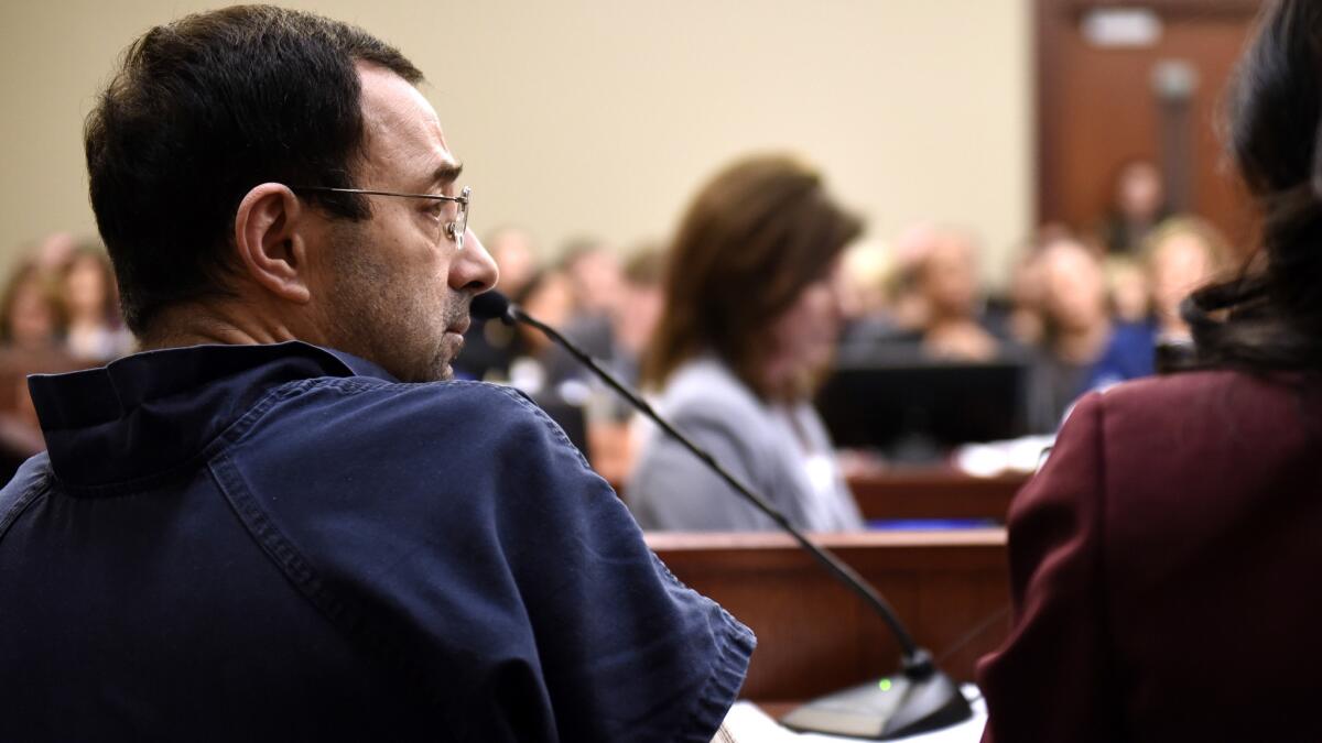 Larry Nassar sits in court during a sentencing hearing Thursday, waiting for the third day of victim impact statements to begin.