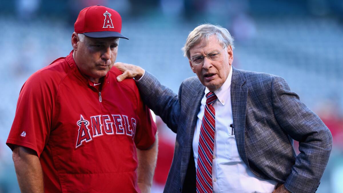 Angels Manager Mike Scioscia, left, speaks with MLB Commissioner Bud Selig before Wednesday's game against the Miami Marlins at Angel Stadium.