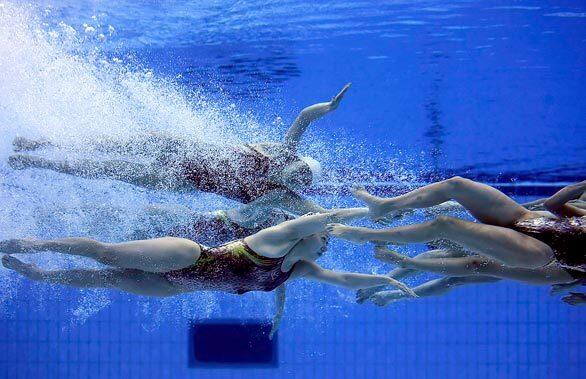 Japan's synchronized swimming team practices at the National Aquatics Center in the Olympic Green Park.