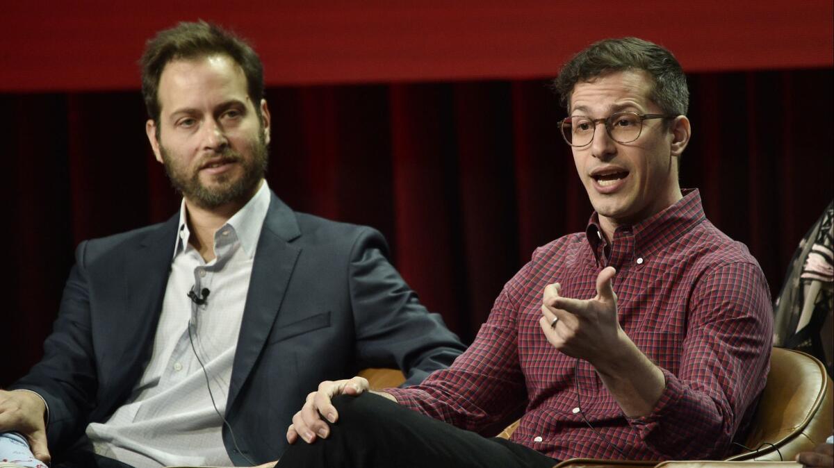 Andy Samberg, right, a cast member in the NBC Universal television series "Brooklyn Nine-Nine," answers a reporter's question as executive producer Dan Goor looks on during the 2018 Television Critics Assn. summer press tour.