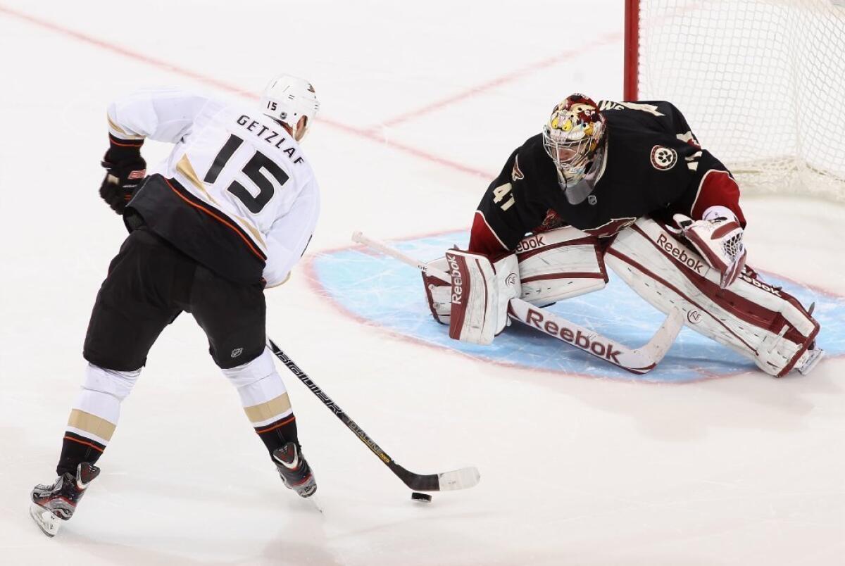 The Ducks' Ryan Getzlaf skates in to score a shootout goal against Phoenix Coyotes' Mike Smith during a March 4 game.