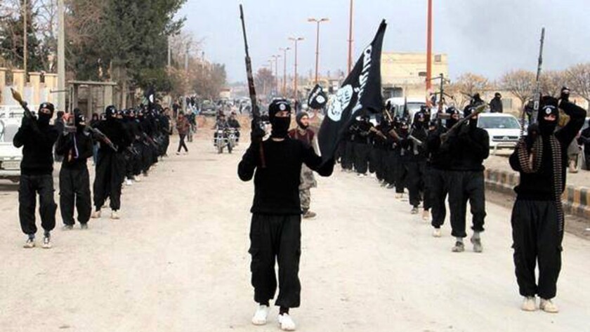 An image posted on a militant website in January reportedly shows Islamic State fighters marching in Raqqah, Syria.
