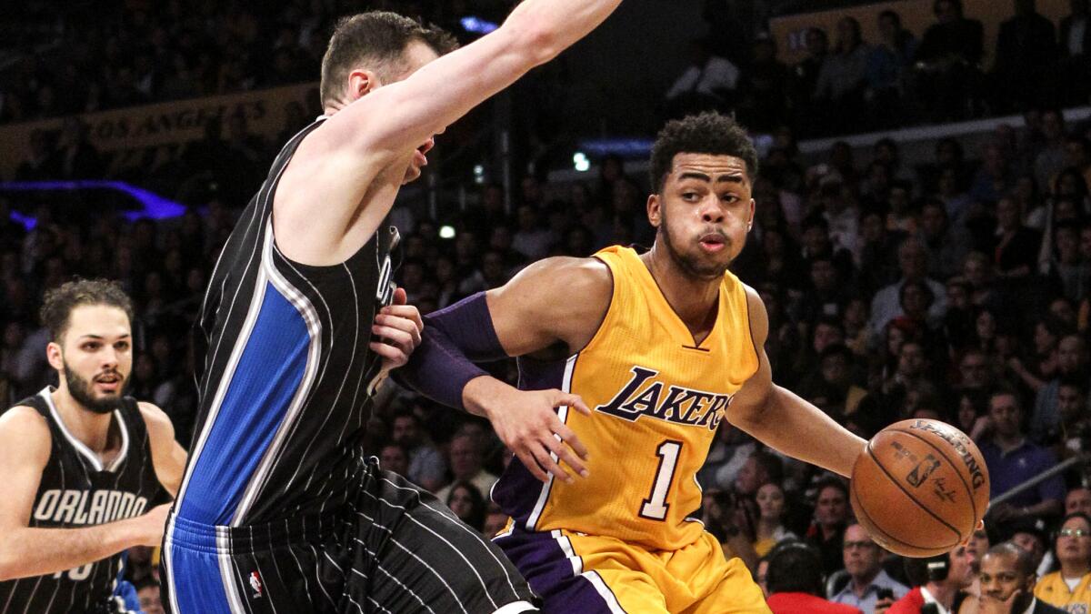 Lakers guard D’Angelo Russell drives to the basket against the Orlando Magic on Tuesday.