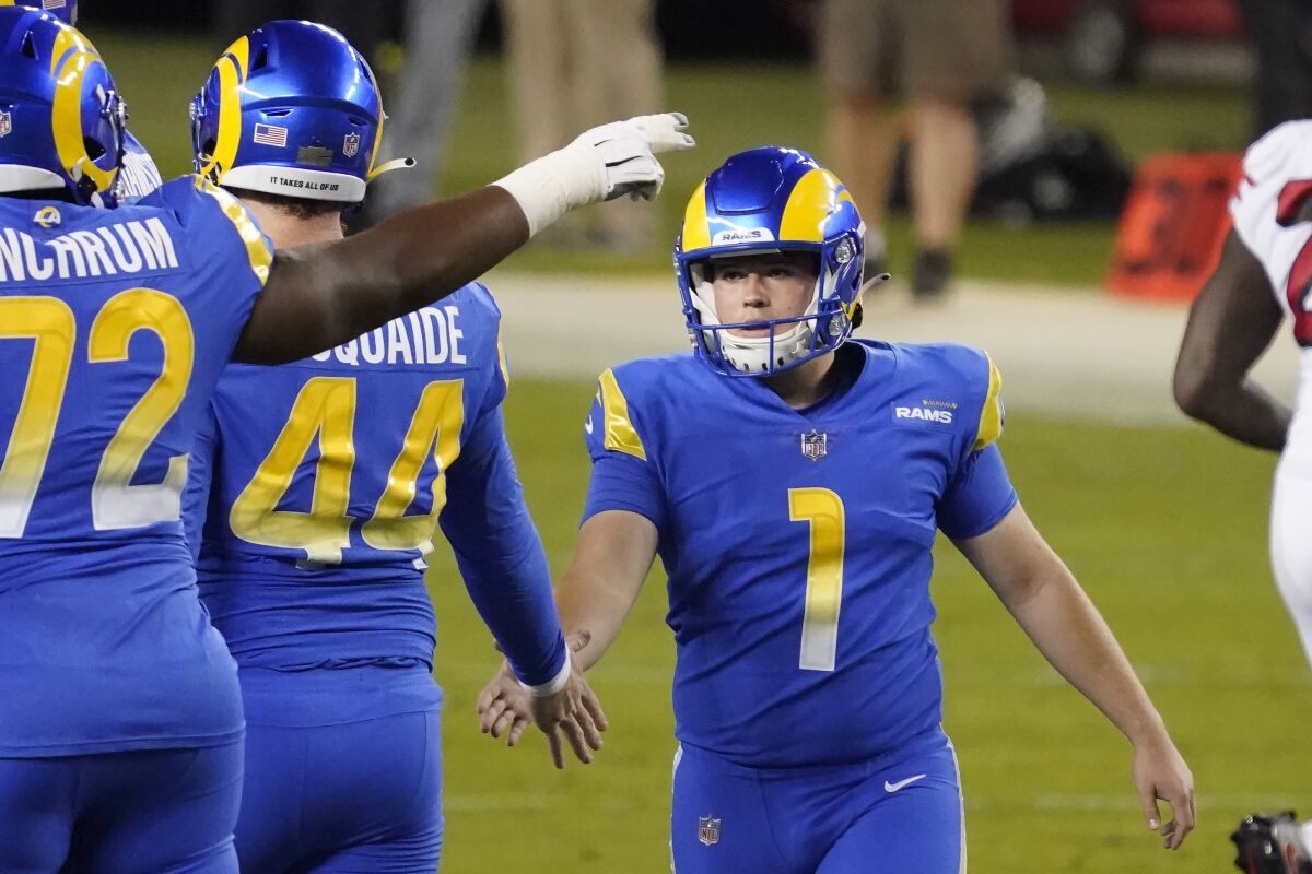 Rams kicker Samuel Sloman (1) is greeted by teammates after kicking a field goal against the 49ers.
