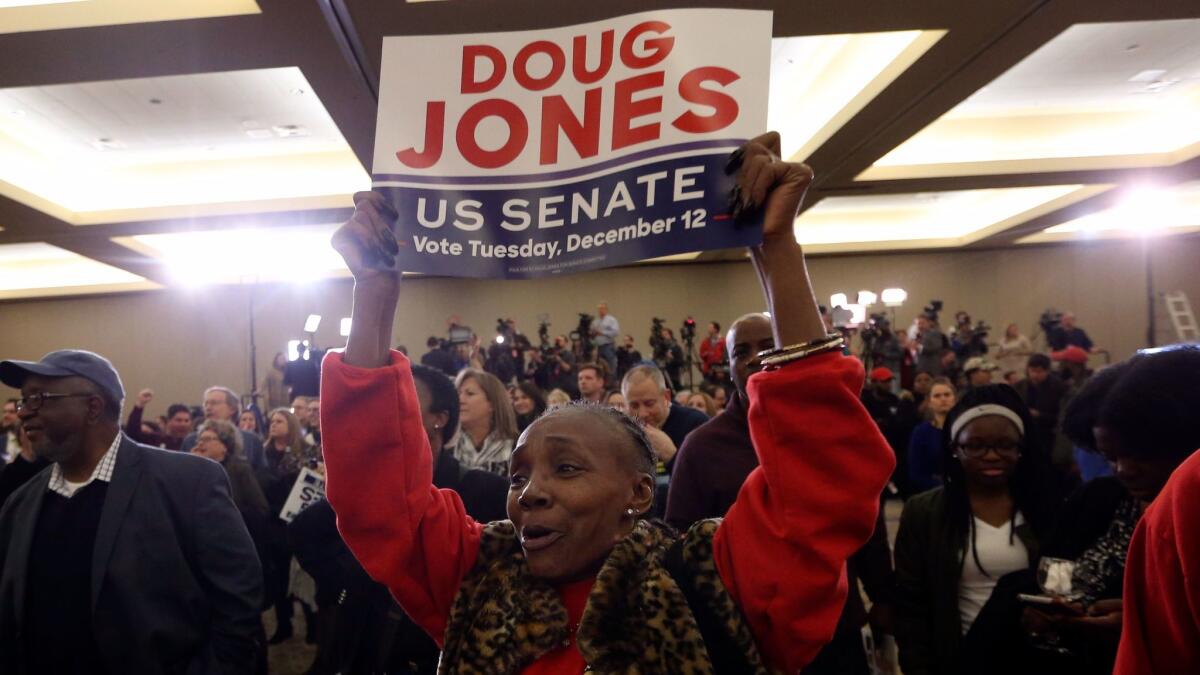 Supporters of Doug Jones wait for results during an election-night watch party in Birmingham , Ala., on Dec. 12.