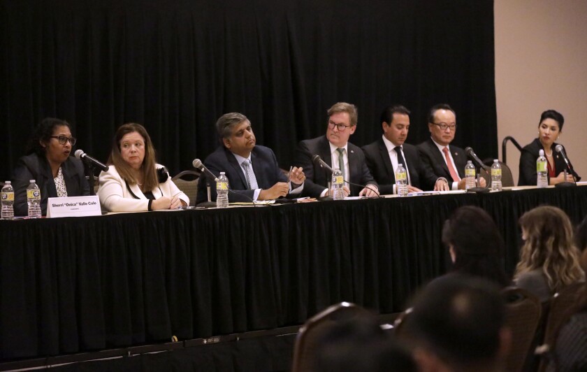 The candidates for Los Angeles city attorney participate in a forum at Cal State Los Angeles on April 27.