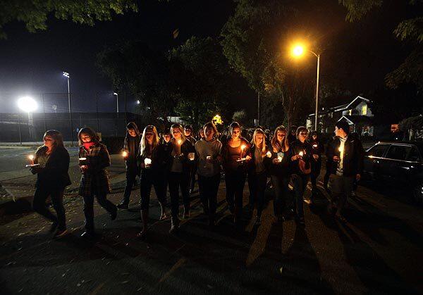 Students from South Pasadena High School lead a memorial walk for classmate Aydin Salek, who died Sunday, from the school to his parents' home.