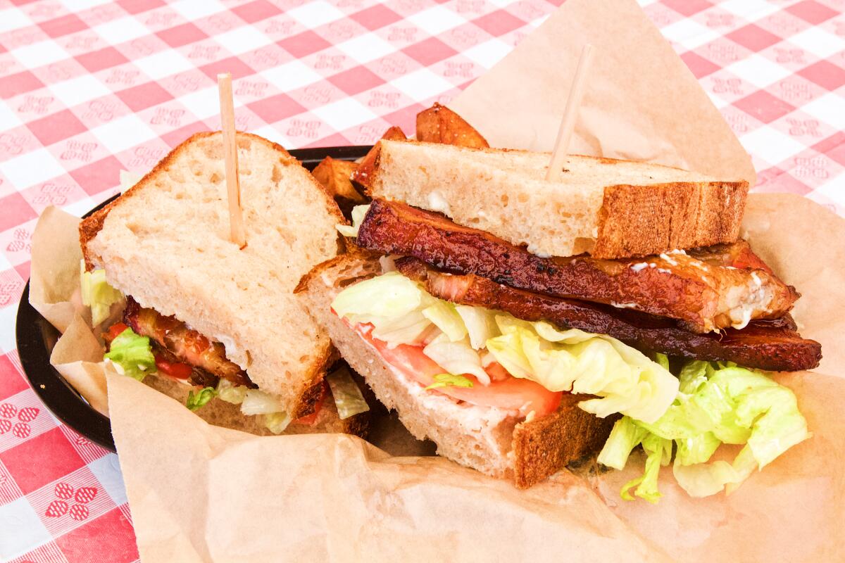 A photo of Shady Grove Food's BLT, which features thick-cut bourbon bacon, smoked in house.