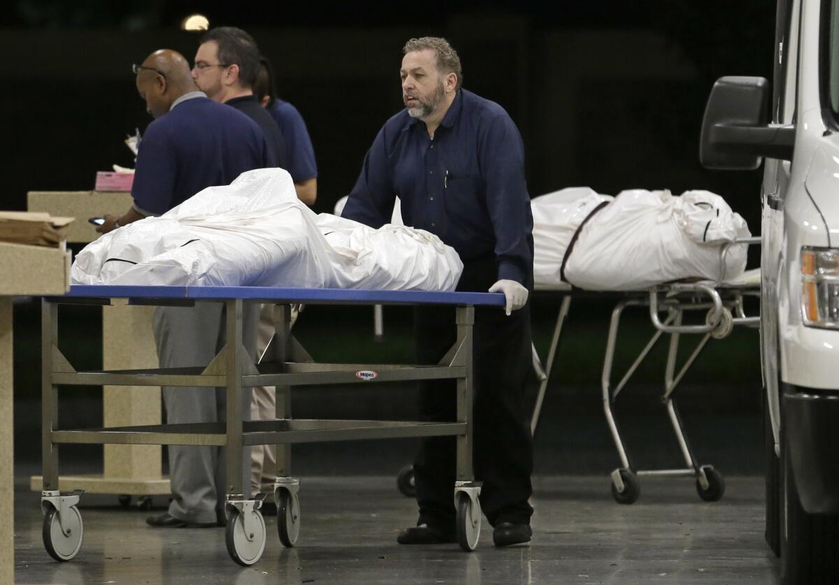 The bodies of two massacre victims arrive at the medical examiner's office in Orlando, Fla., on June 12, 2016.