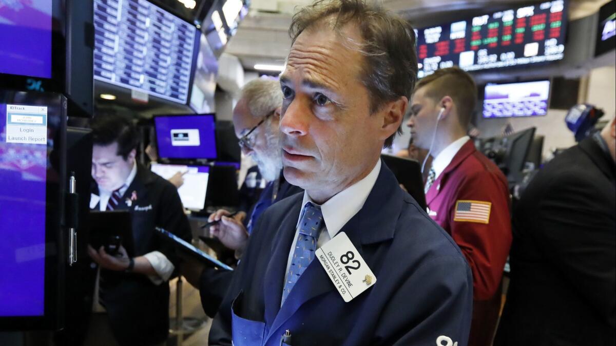 Trader Dudley Devine on the floor of the New York Stock Exchange on May 23.