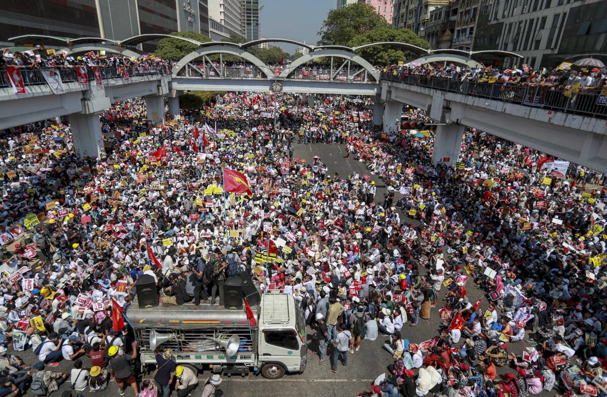 Huge crowds mass at an intersection in Yangon, Myanmar.