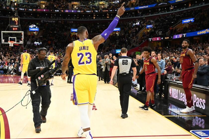 CLEVELAND, OH - NOVEMBER 21: LeBron James #23 of the Los Angeles Lakers recognizes the fans after the Cleveland Cavaliers honored James during a time-out during the first half at Quicken Loans Arena on November 21, 2018 in Cleveland, Ohio. NOTE TO USER: User expressly acknowledges and agrees that, by downloading and/or using this photograph, user is consenting to the terms and conditions of the Getty Images License Agreement. (Photo by Jason Miller/Getty Images) ** OUTS - ELSENT, FPG, CM - OUTS * NM, PH, VA if sourced by CT, LA or MoD **
