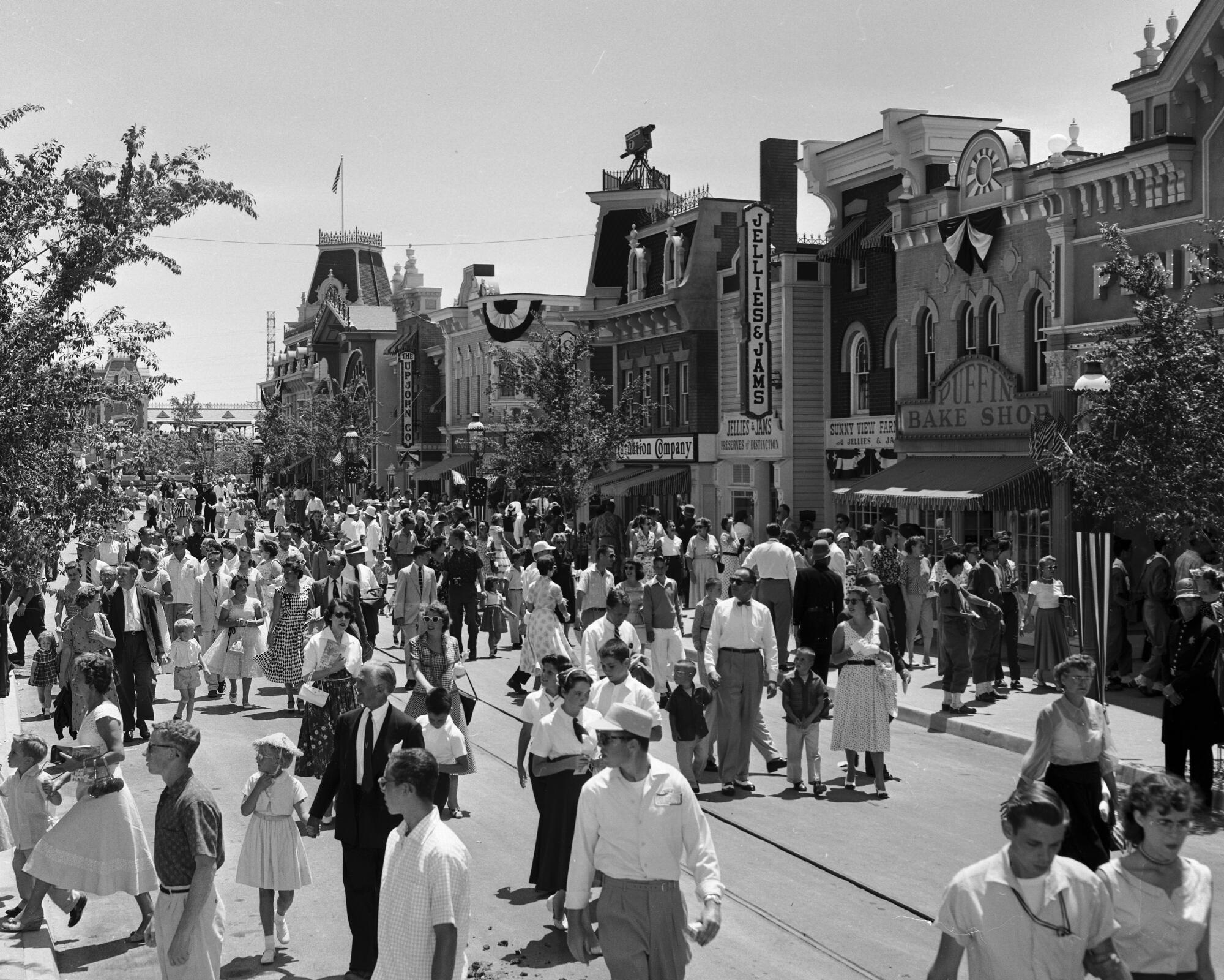People milling on Disneyland's Main Street in 1955.