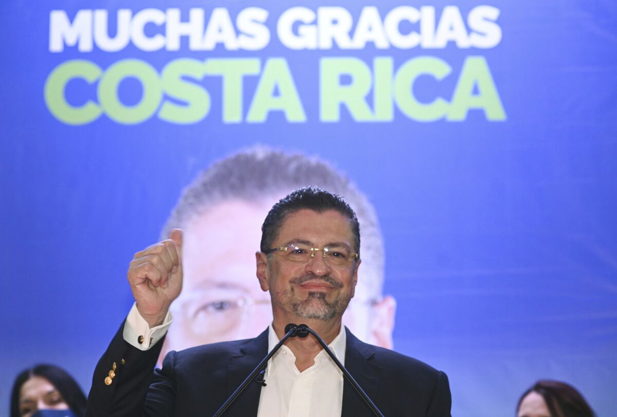 Costa Rica's former finance minister Rodrigo Chaves speaks to supporters at his headquarters in San Jose, Costa Rica, after winning a presidential runoff election, Sunday, April 3, 2022. (AP Photo/Carlos Gonzalez)