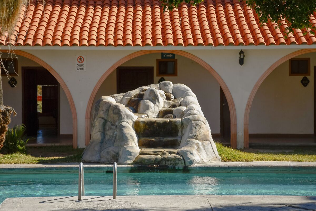 A hotel courtyard with a pool