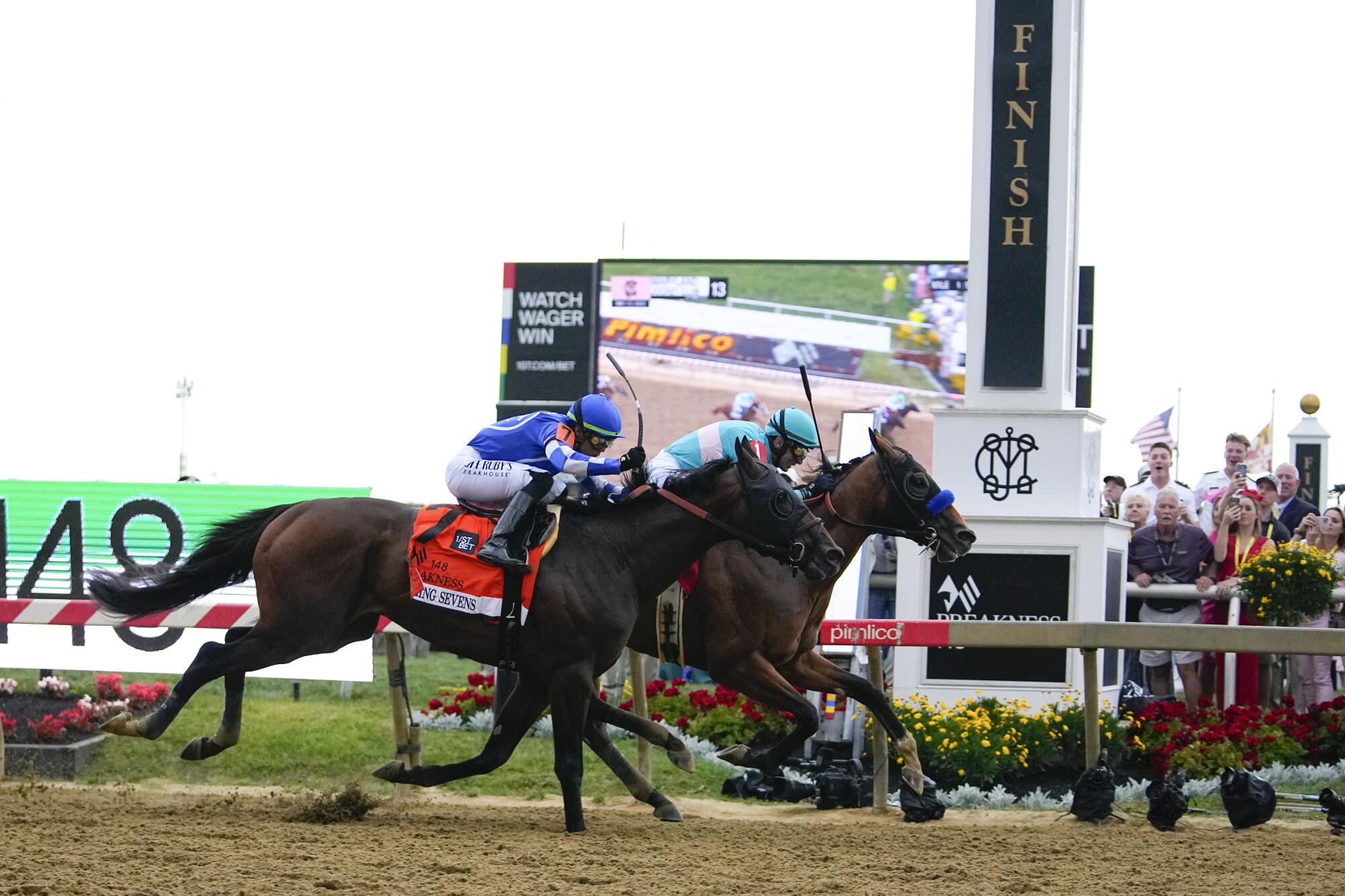National Treasure edges out Blazing Sevens to win the148th running of the Preakness Stakes.
