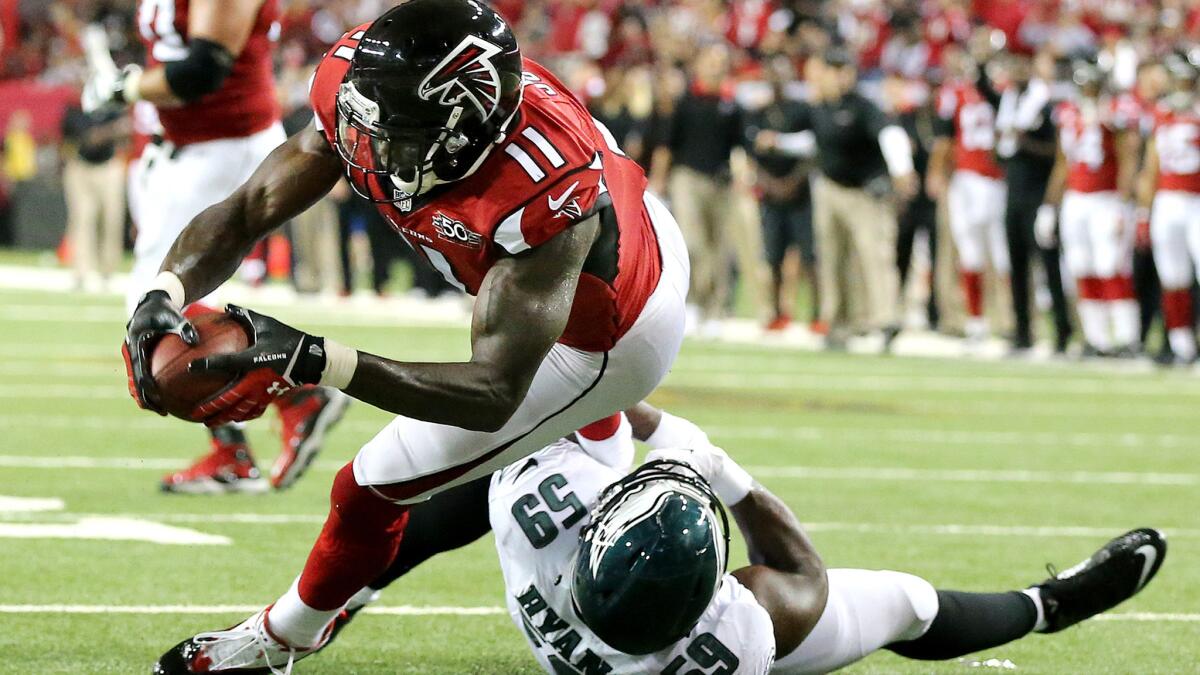 Falcons wide receiver Julio Jones breaks free from Eagles linebacker DeMeco Ryans and dives across the goal line for a touchdown on Monday night.