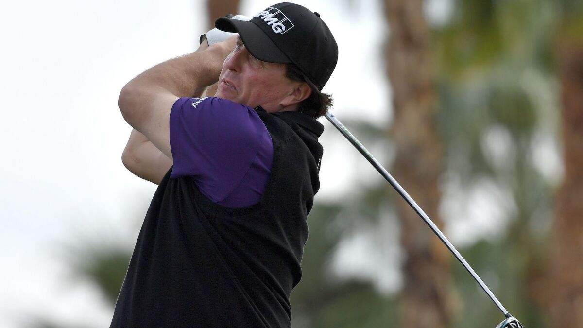 Phil Mickelson tees off at the fourth hole during the second round of the Desert Classic at the Nicklaus Tournament Course in La Quinta.